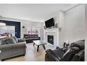 24 Saddlestone Way, Calgary, AB  - Indoor Photo Showing Living Room With Fireplace 