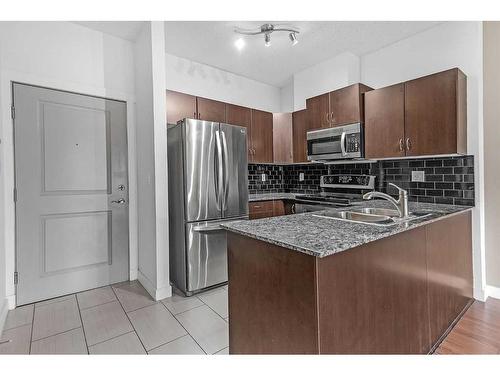 5603-11811 Lake Fraser Drive Se, Calgary, AB - Indoor Photo Showing Kitchen With Stainless Steel Kitchen With Double Sink