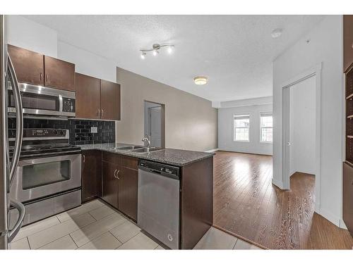 5603-11811 Lake Fraser Drive Se, Calgary, AB - Indoor Photo Showing Kitchen With Double Sink