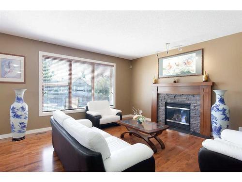 74 Elgin Park Road Se, Calgary, AB - Indoor Photo Showing Living Room With Fireplace
