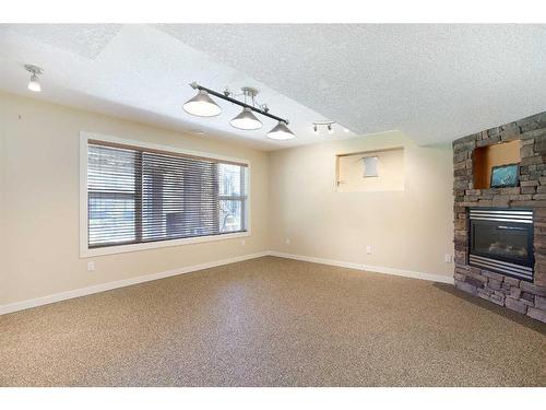 74 Elgin Park Road Se, Calgary, AB - Indoor With Fireplace