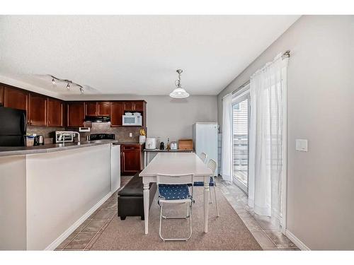 109 Cougar Plateau Mews Sw, Calgary, AB - Indoor Photo Showing Kitchen