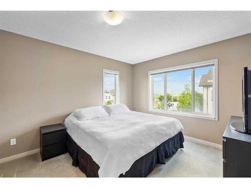 101 Copperpond Row Se, Calgary, AB - Indoor Photo Showing Bedroom