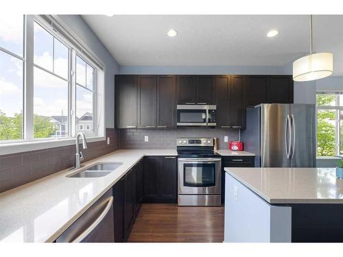 101 Copperpond Row Se, Calgary, AB - Indoor Photo Showing Kitchen With Double Sink With Upgraded Kitchen