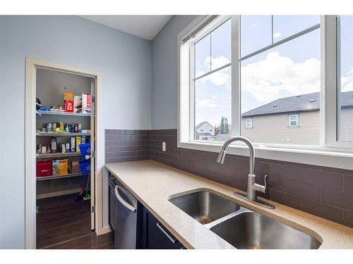 101 Copperpond Row Se, Calgary, AB - Indoor Photo Showing Kitchen With Double Sink