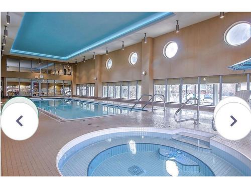 1705-55 Spruce Place Sw, Calgary, AB - Indoor Photo Showing Other Room With In Ground Pool