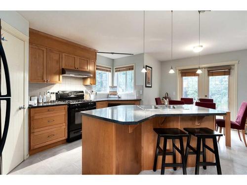 18 Valley Crest Close Nw, Calgary, AB - Indoor Photo Showing Kitchen With Double Sink