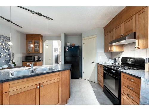 18 Valley Crest Close Nw, Calgary, AB - Indoor Photo Showing Kitchen With Double Sink