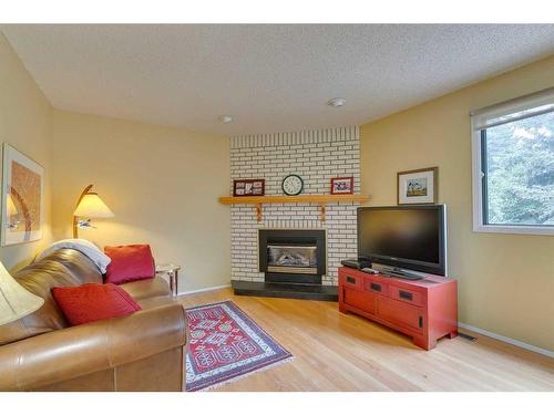 812 Edgemont Road Nw, Calgary, AB - Indoor Photo Showing Living Room With Fireplace