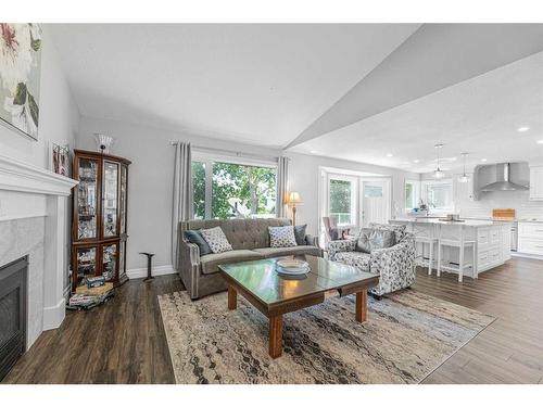 129 Sceptre Court Nw, Calgary, AB - Indoor Photo Showing Living Room With Fireplace