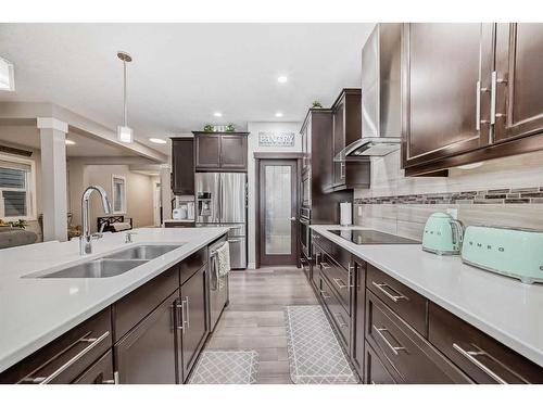 7916 Masters Boulevard Se, Calgary, AB - Indoor Photo Showing Kitchen With Double Sink With Upgraded Kitchen