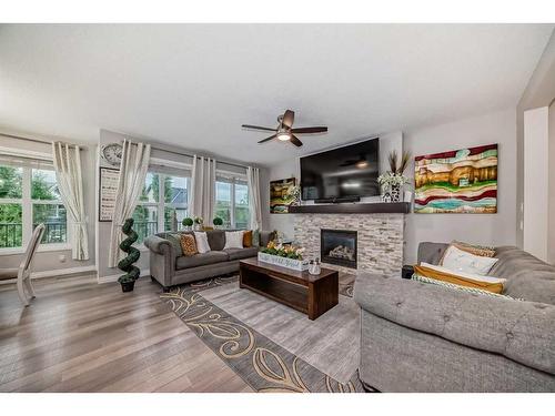 7916 Masters Boulevard Se, Calgary, AB - Indoor Photo Showing Living Room With Fireplace