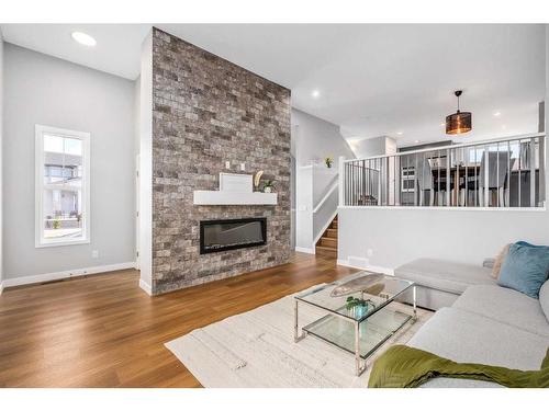 133 Magnolia Terrace Se, Calgary, AB - Indoor Photo Showing Living Room With Fireplace