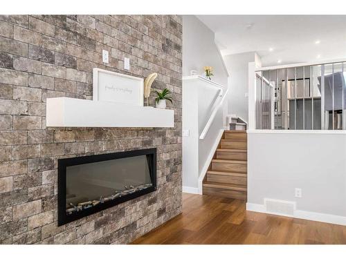 133 Magnolia Terrace Se, Calgary, AB - Indoor Photo Showing Living Room With Fireplace