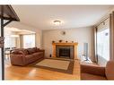143 Copperfield Rise Se, Calgary, AB  - Indoor Photo Showing Living Room With Fireplace 