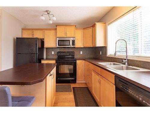 143 Copperfield Rise Se, Calgary, AB - Indoor Photo Showing Kitchen With Double Sink