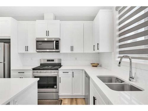 26 Evanston Hill Nw, Calgary, AB - Indoor Photo Showing Kitchen With Stainless Steel Kitchen With Double Sink