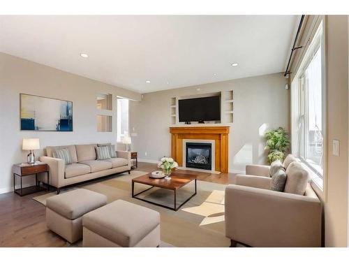 99 Pantego Way Nw, Calgary, AB - Indoor Photo Showing Living Room With Fireplace