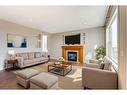 99 Pantego Way Nw, Calgary, AB  - Indoor Photo Showing Living Room With Fireplace 