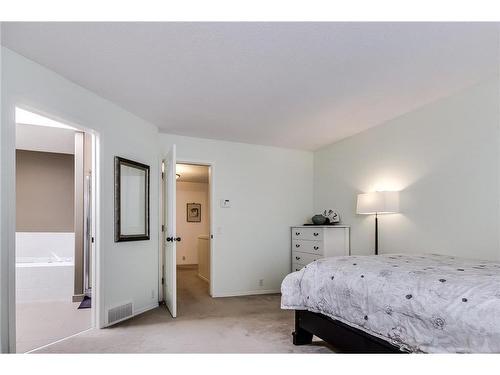 226 Sienna Park Gardens Sw, Calgary, AB - Indoor Photo Showing Bedroom