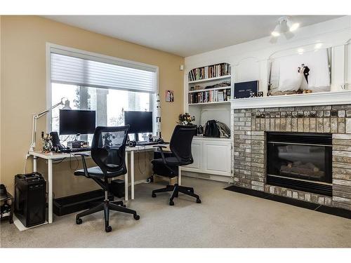 226 Sienna Park Gardens Sw, Calgary, AB - Indoor Photo Showing Office With Fireplace