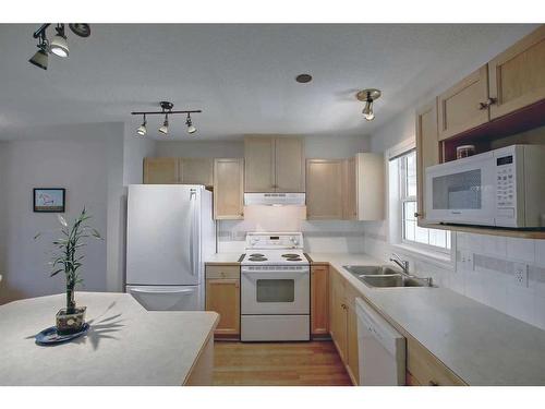 200-7707 Martha'S Haven Park Ne, Calgary, AB - Indoor Photo Showing Kitchen With Double Sink