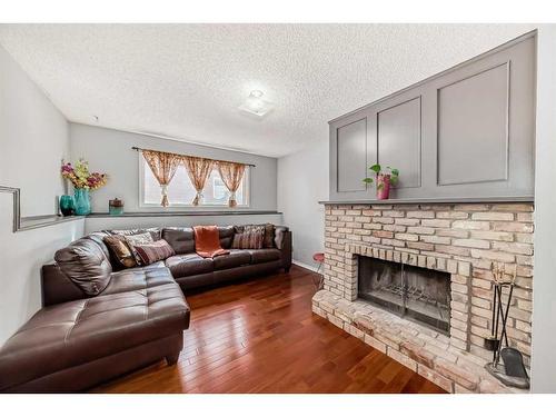 235 Templemont Drive Ne, Calgary, AB - Indoor Photo Showing Living Room With Fireplace