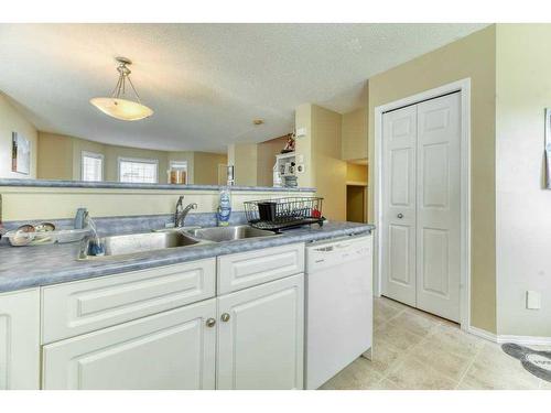 193 Prestwick Acres Se, Calgary, AB - Indoor Photo Showing Kitchen With Double Sink