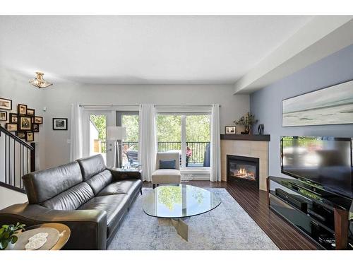 307 Valley Ridge Manor Nw, Calgary, AB - Indoor Photo Showing Living Room With Fireplace