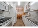 1307-4001A 49 Street Nw, Calgary, AB  - Indoor Photo Showing Kitchen With Double Sink With Upgraded Kitchen 