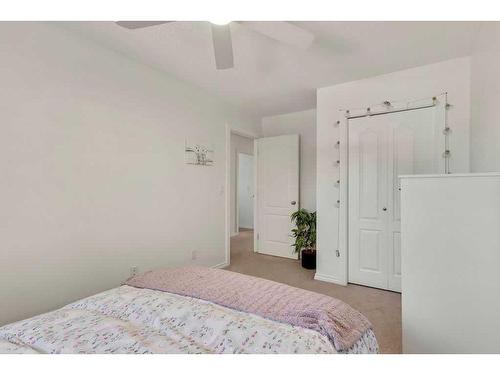 121 Crystal Shores Grove, Okotoks, AB - Indoor Photo Showing Bedroom