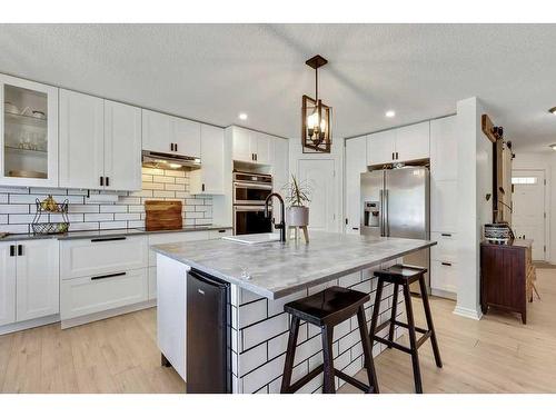 121 Crystal Shores Grove, Okotoks, AB - Indoor Photo Showing Kitchen With Upgraded Kitchen