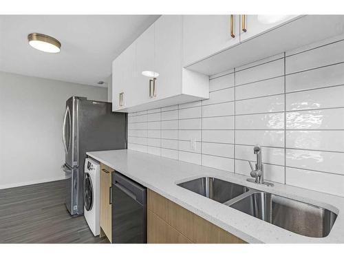 401-1817 16 Street Sw, Calgary, AB - Indoor Photo Showing Kitchen With Double Sink