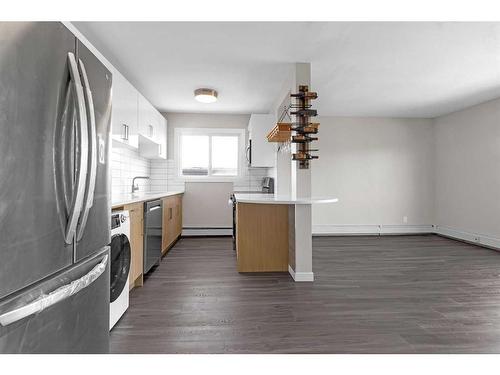 401-1817 16 Street Sw, Calgary, AB - Indoor Photo Showing Kitchen With Stainless Steel Kitchen