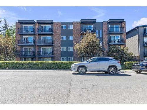 401-1817 16 Street Sw, Calgary, AB - Outdoor With Balcony With Facade