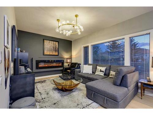 14 Prominence View Sw, Calgary, AB - Indoor Photo Showing Living Room With Fireplace