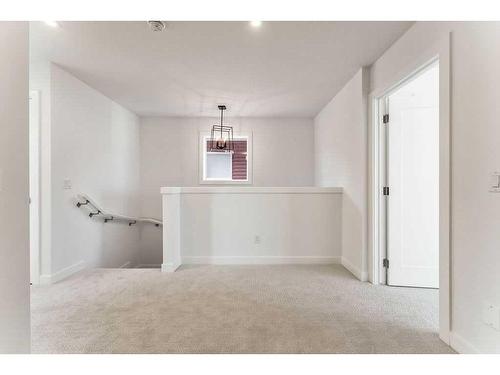 225 Creekside Drive Sw, Calgary, AB - Indoor Photo Showing Other Room