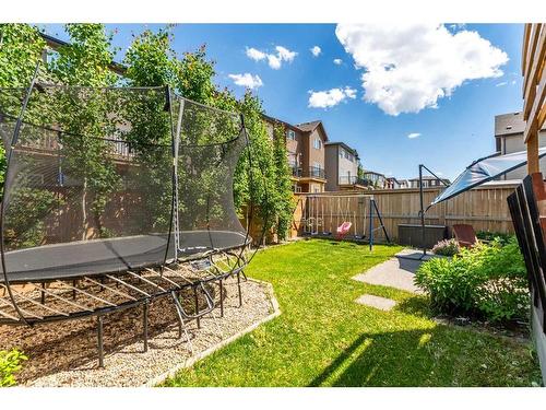 305 Carringvue Manor Nw, Calgary, AB - Outdoor With Backyard