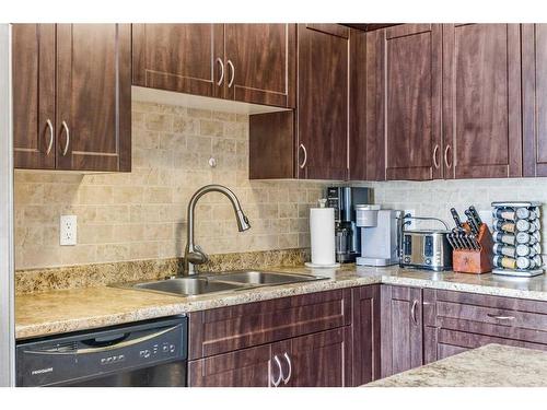 905-2200 Woodview Drive Sw, Calgary, AB - Indoor Photo Showing Kitchen With Double Sink