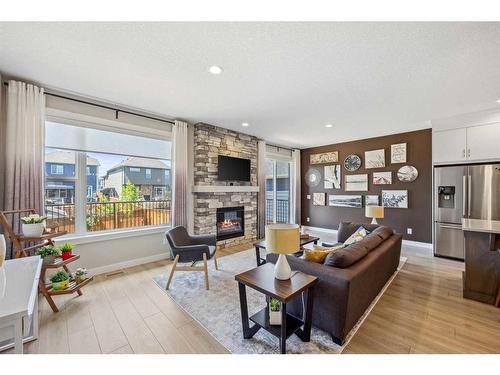 13 Cranbrook Close Se, Calgary, AB - Indoor Photo Showing Living Room With Fireplace
