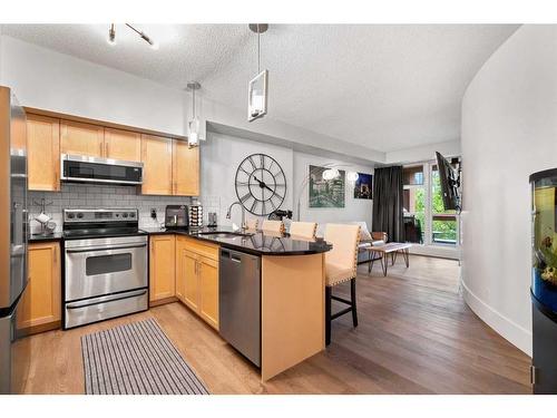 310-205 Riverfront Avenue Sw, Calgary, AB - Indoor Photo Showing Kitchen With Stainless Steel Kitchen