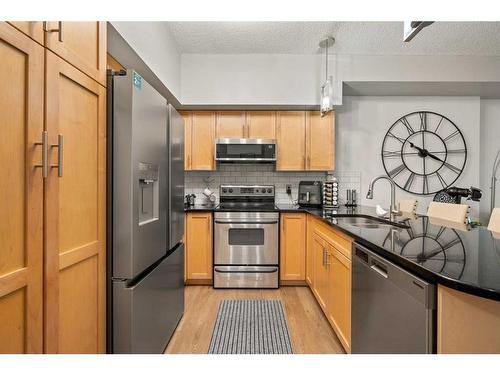 310-205 Riverfront Avenue Sw, Calgary, AB - Indoor Photo Showing Kitchen With Stainless Steel Kitchen