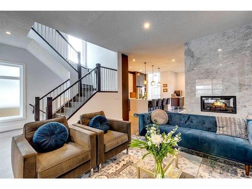 2427 3 Avenue Nw, Calgary, AB - Indoor Photo Showing Living Room With Fireplace