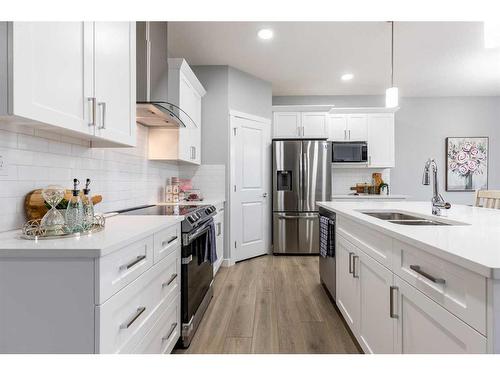 128 Sora Terrace, Calgary, AB - Indoor Photo Showing Kitchen With Double Sink With Upgraded Kitchen