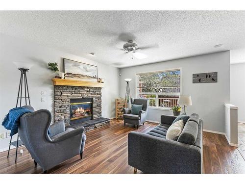 75 Brightondale Crescent Se, Calgary, AB - Indoor Photo Showing Living Room With Fireplace