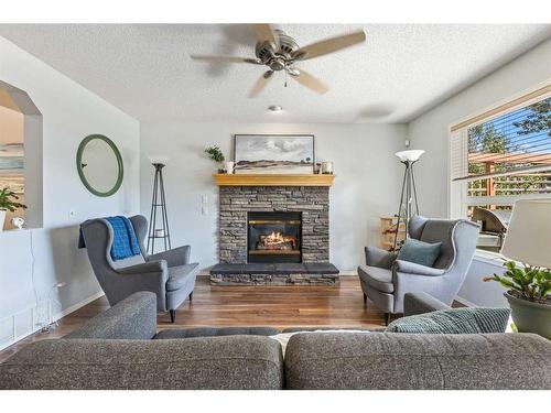 75 Brightondale Crescent Se, Calgary, AB - Indoor Photo Showing Living Room With Fireplace