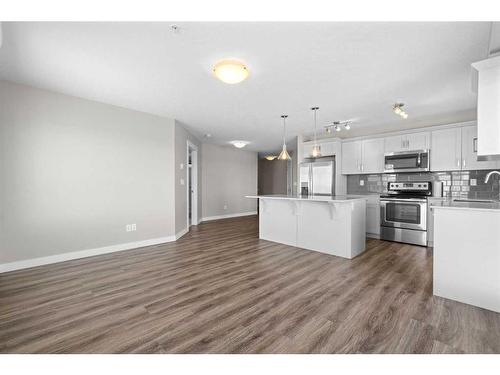 316-110 Auburn Meadows View Se, Calgary, AB - Indoor Photo Showing Kitchen With Stainless Steel Kitchen With Upgraded Kitchen