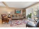 113-2300 Oakmoor Drive Sw, Calgary, AB  - Indoor Photo Showing Living Room 