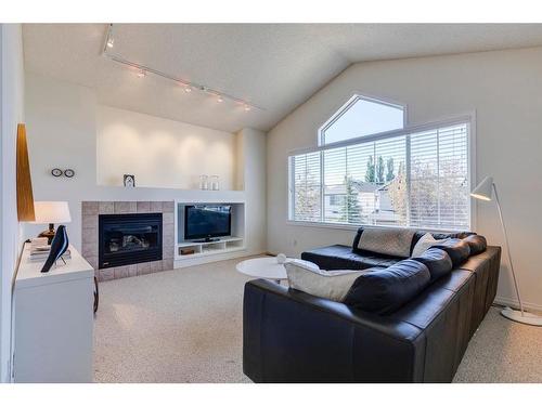 253 River Rock Place Se, Calgary, AB - Indoor Photo Showing Living Room With Fireplace
