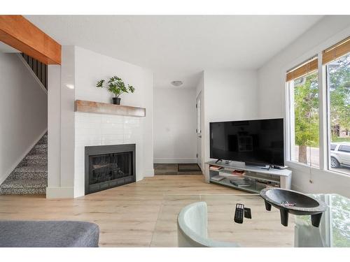 15 Templemont Drive Ne, Calgary, AB - Indoor Photo Showing Living Room With Fireplace